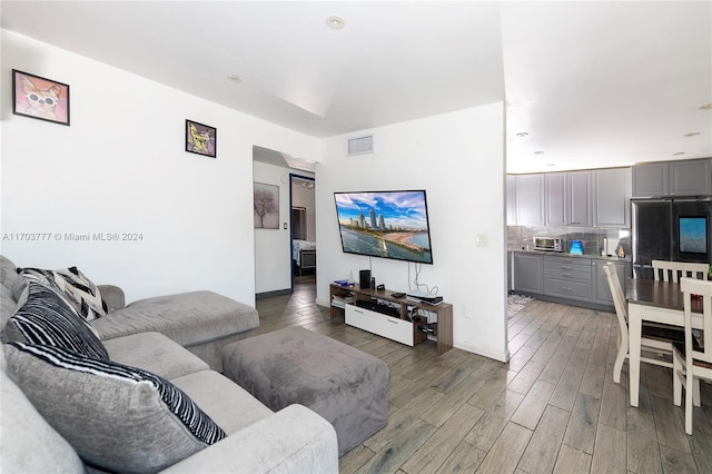 living room featuring dark hardwood / wood-style floors