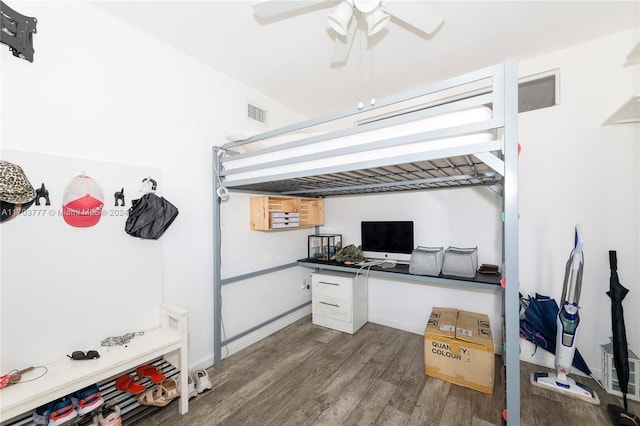 bedroom featuring ceiling fan and dark wood-type flooring