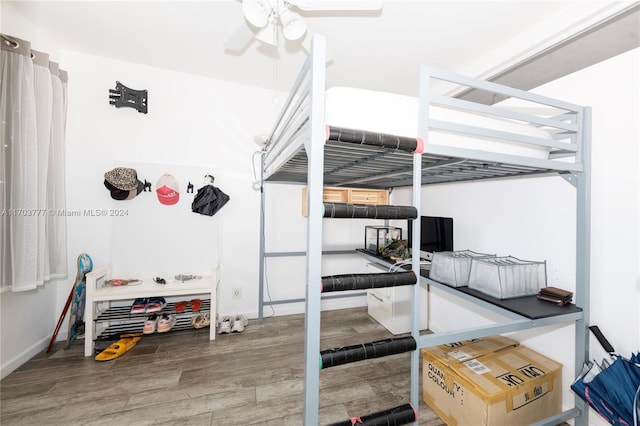 bedroom featuring hardwood / wood-style floors and ceiling fan