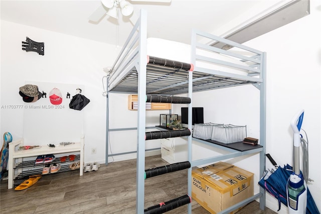 bedroom with hardwood / wood-style flooring and ceiling fan