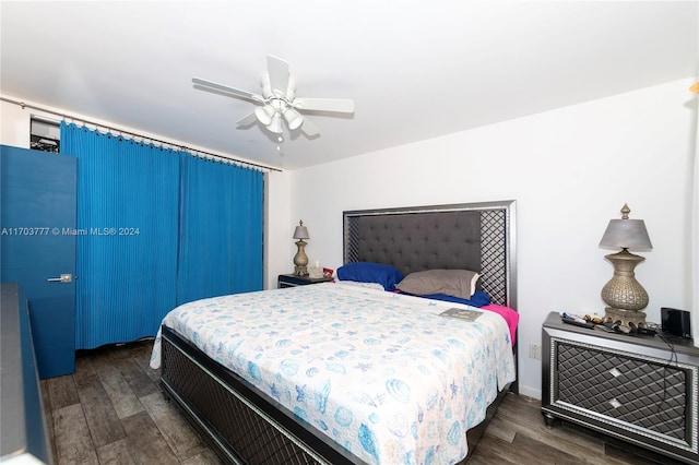 bedroom featuring ceiling fan and dark wood-type flooring