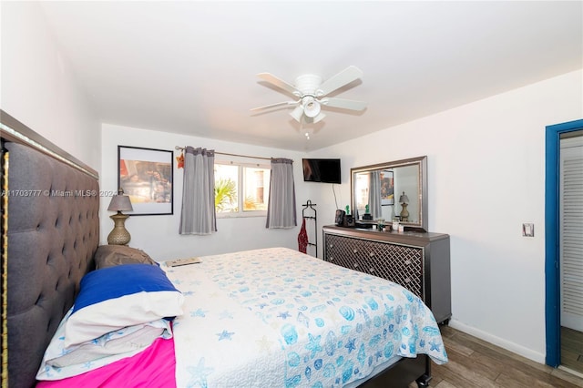 bedroom with hardwood / wood-style floors and ceiling fan