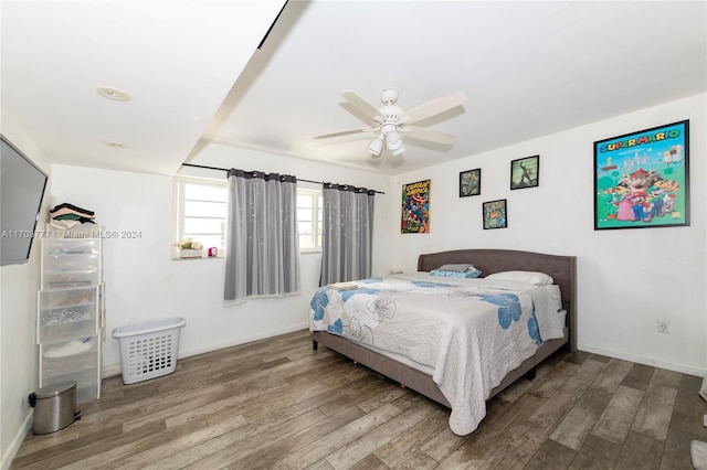 bedroom featuring hardwood / wood-style floors and ceiling fan