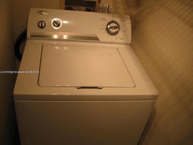 washroom with washer / dryer