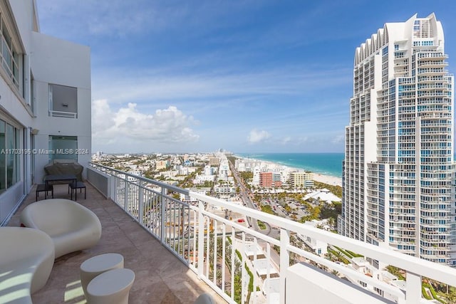 balcony featuring a water view