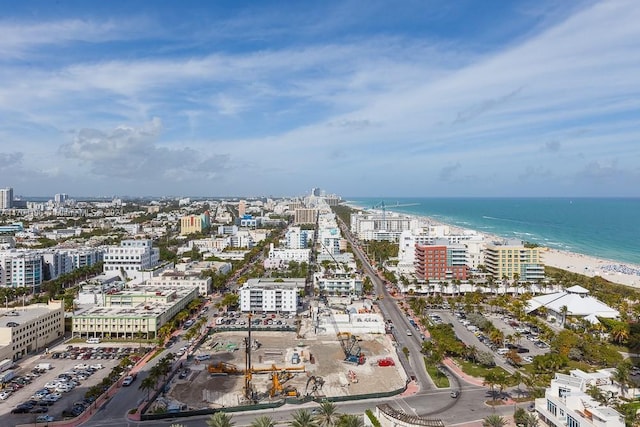 birds eye view of property featuring a water view and a view of the beach