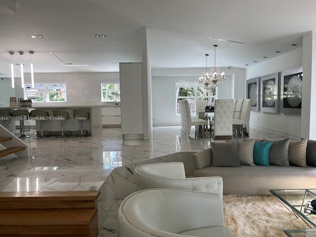 living room with an inviting chandelier