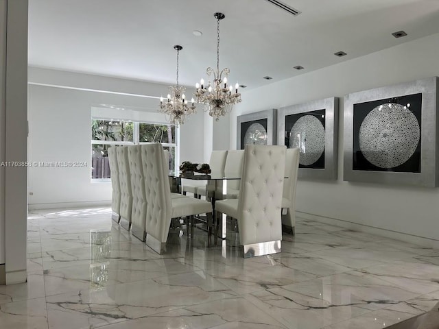 dining space featuring a chandelier