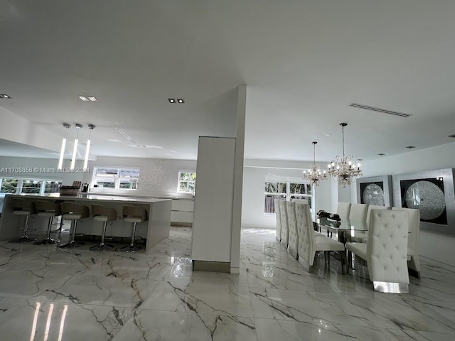 dining area with a notable chandelier