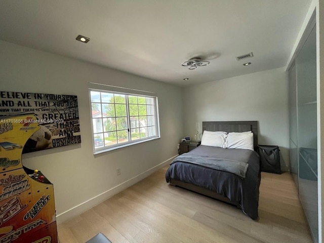 bedroom with light wood-type flooring