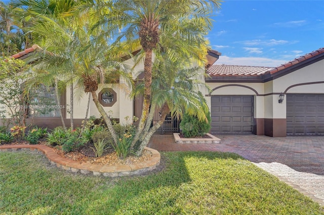 mediterranean / spanish-style house with a garage