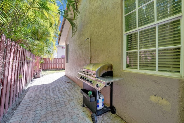 view of patio / terrace featuring grilling area and fence