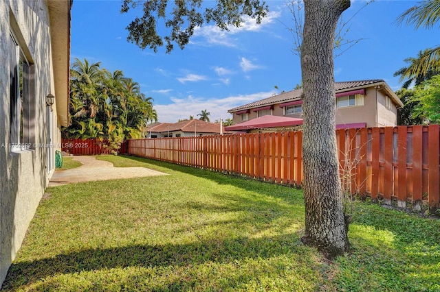 view of yard with a patio and a fenced backyard