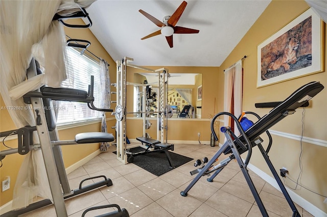 exercise room featuring ceiling fan, lofted ceiling, and light tile patterned floors