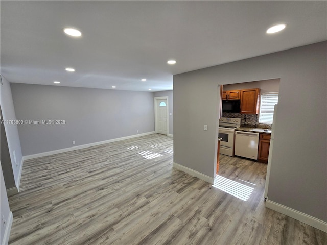 unfurnished living room with light wood-type flooring