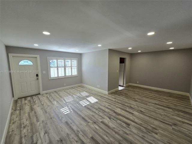 entrance foyer with hardwood / wood-style floors