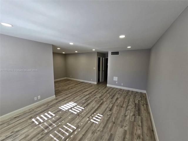 empty room with wood-type flooring