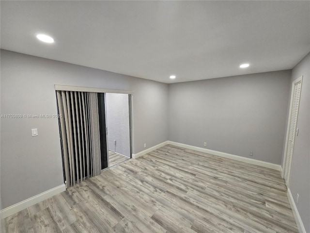 spare room featuring light hardwood / wood-style floors