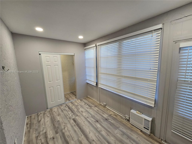 spare room featuring light hardwood / wood-style floors