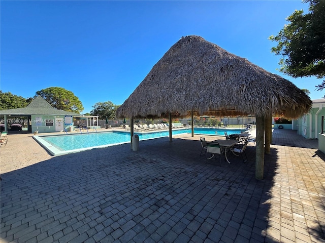 view of swimming pool featuring a gazebo and a patio