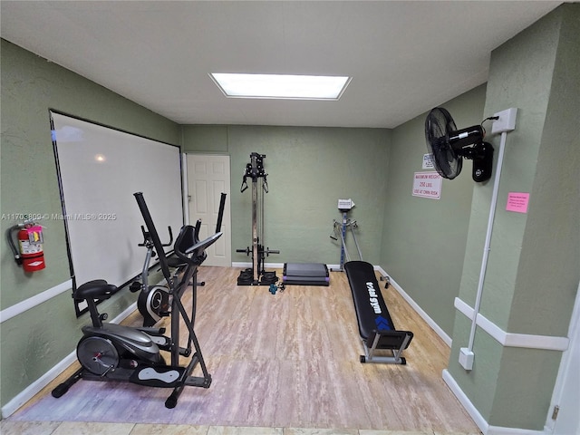 workout room with hardwood / wood-style flooring