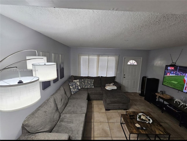 tiled living room with a textured ceiling