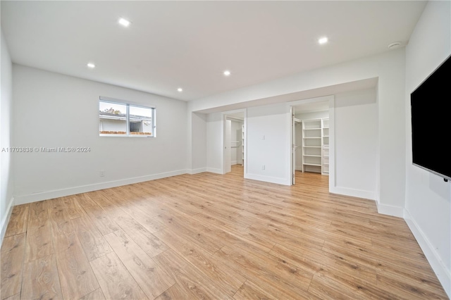 unfurnished living room with light wood-type flooring