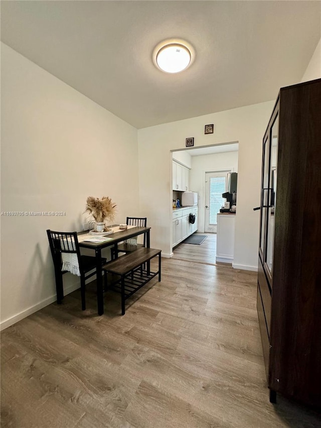 dining room with light wood-type flooring