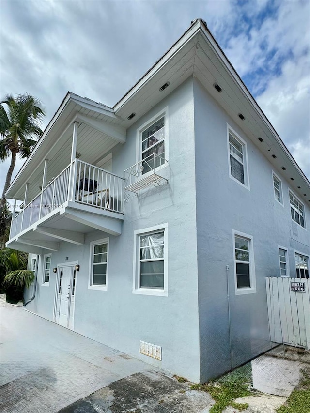 view of property exterior with a balcony