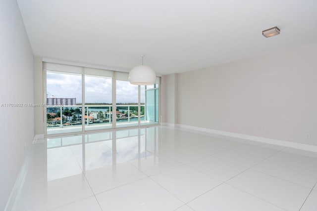 empty room with light tile patterned flooring