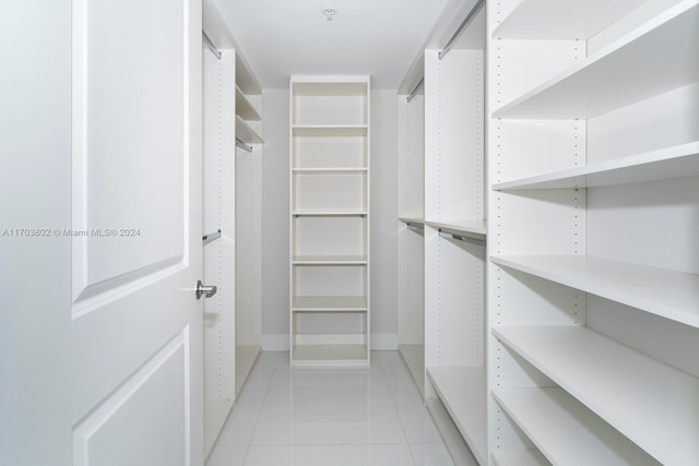 spacious closet featuring light tile patterned floors