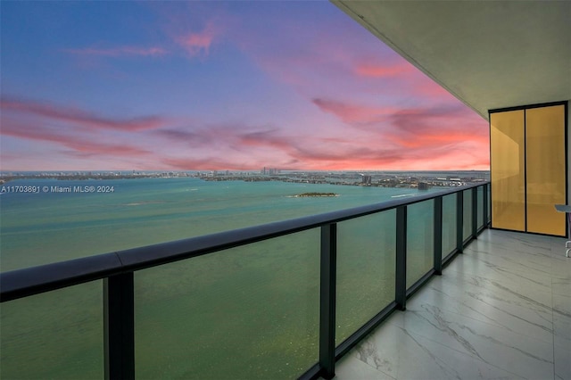 balcony at dusk with a water view