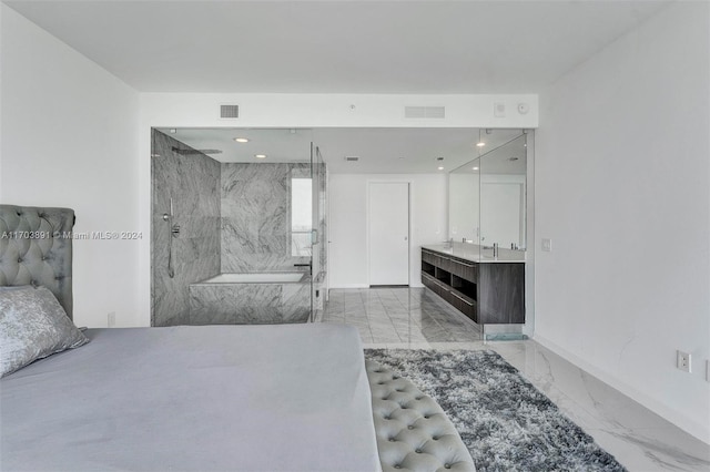 bathroom with vanity and a tile shower