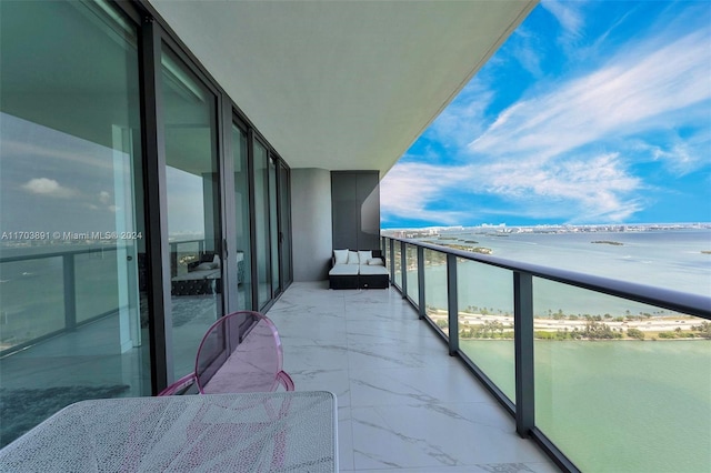 balcony featuring a water view