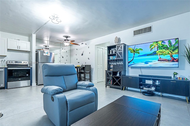 living room featuring ceiling fan