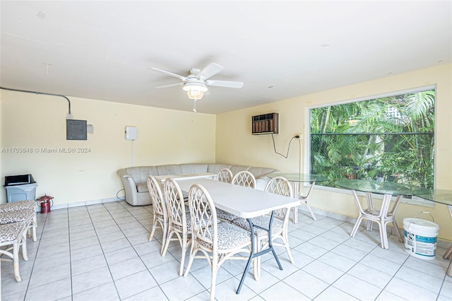 tiled dining room featuring a wall mounted air conditioner, ceiling fan, and electric panel