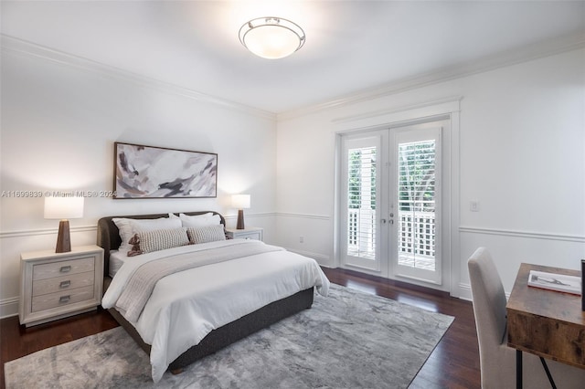 bedroom with access to exterior, french doors, crown molding, and dark wood-type flooring