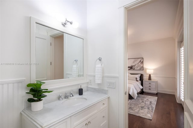 bathroom with hardwood / wood-style floors and vanity