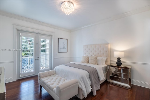 bedroom featuring access to exterior, french doors, dark wood-type flooring, and ornamental molding