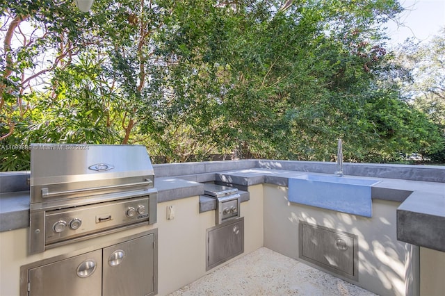 view of patio featuring a grill and exterior kitchen