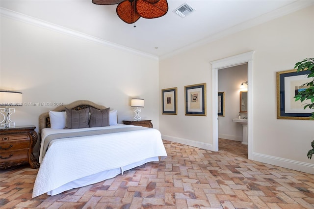 bedroom featuring ensuite bathroom, ceiling fan, and ornamental molding