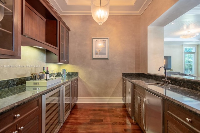 kitchen featuring sink, hanging light fixtures, wine cooler, dark hardwood / wood-style floors, and dark stone counters