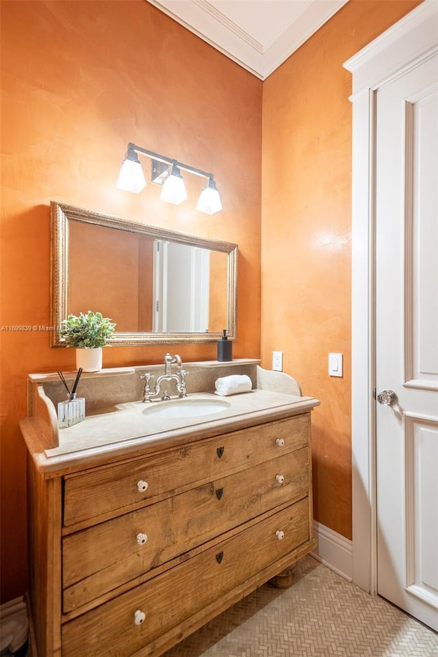 bathroom featuring vanity and ornamental molding