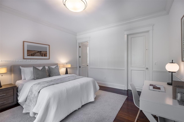 bedroom featuring ornamental molding and dark wood-type flooring