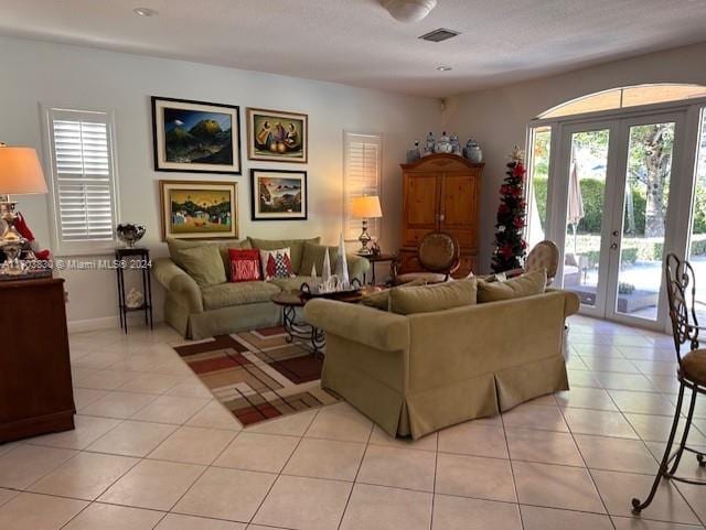 tiled living room with french doors