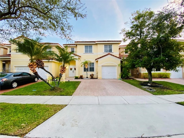 mediterranean / spanish house featuring a front lawn