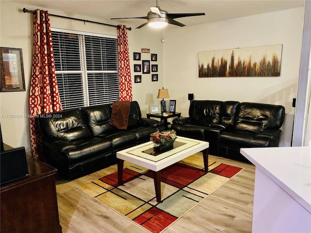 living room with ceiling fan and light hardwood / wood-style floors