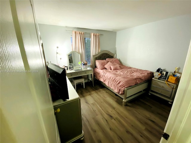 bedroom featuring dark hardwood / wood-style floors