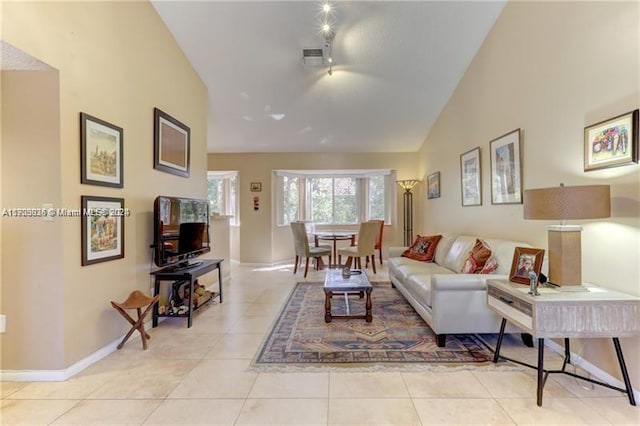 tiled living room with vaulted ceiling