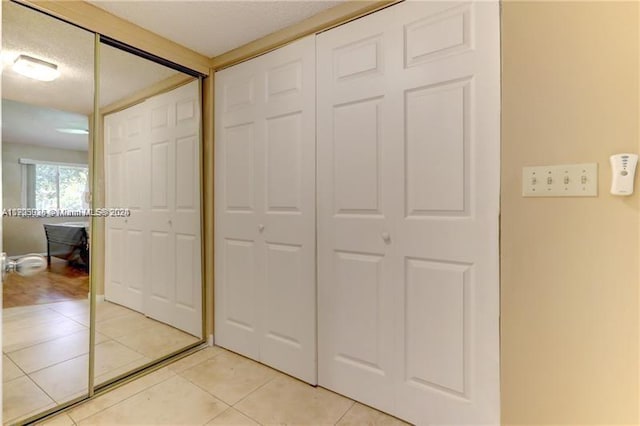 hallway with light tile patterned floors